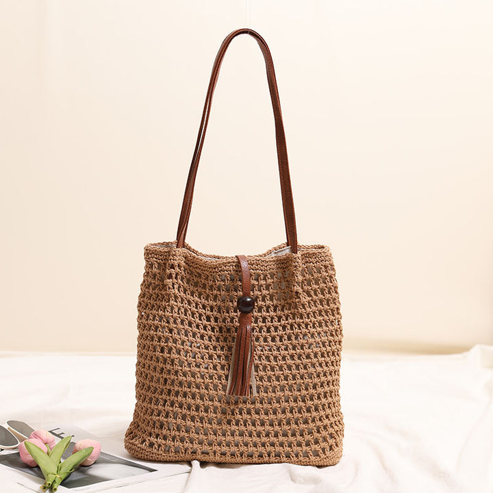 Hand-knotted basket bag with elegant leather handle Skanto