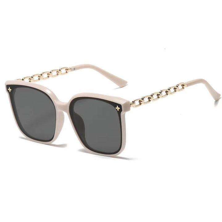 Dame ekstrastor solbrille med modig kjedeinnramming Skanto