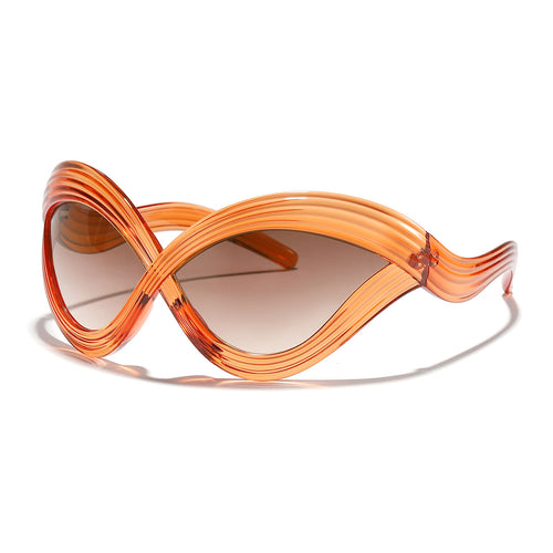 Dame moteriktig solbrille med innovativ bølkeramme Skanto