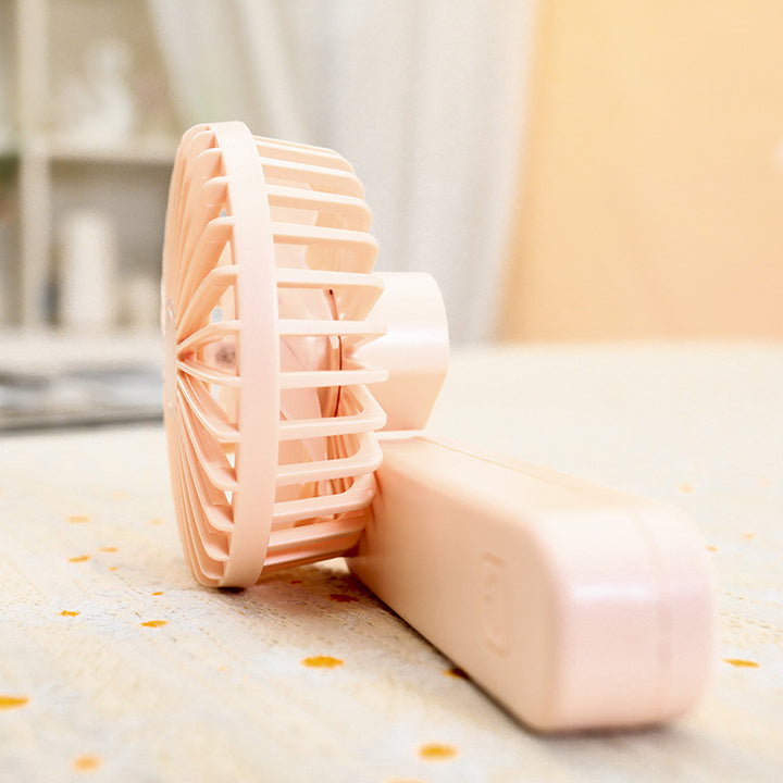Kvinne bærbar håndholdt vifte med ergonomisk design og rask luftstrøm Skanto