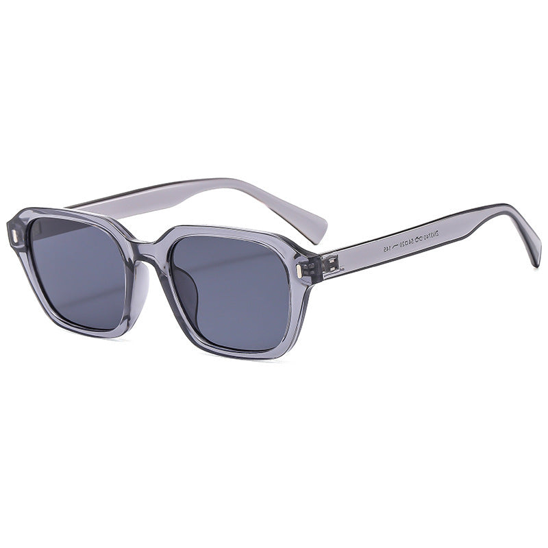 Dame Firkantet solbrille med stilfull gjennomsiktig ramme og UV-beskyttelse Skanto