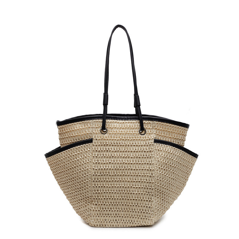 Romslig bast-handletote med elegante lær-detaljer Skanto