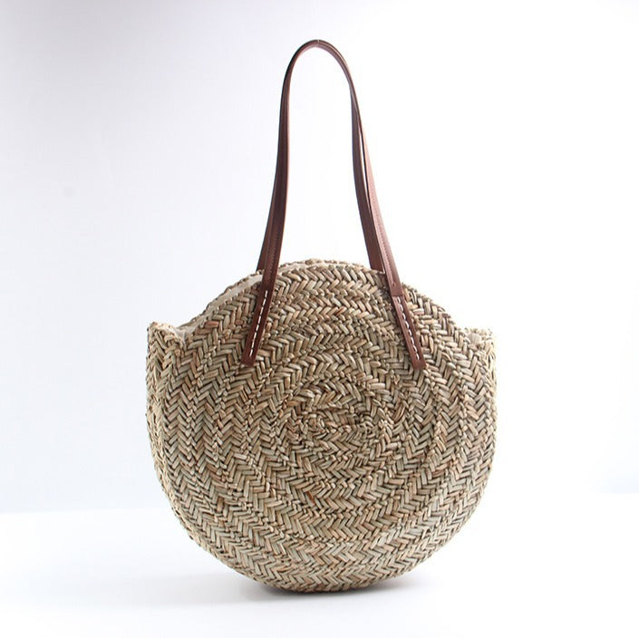 Braided straw beach bag with elegant leather handles Skanto