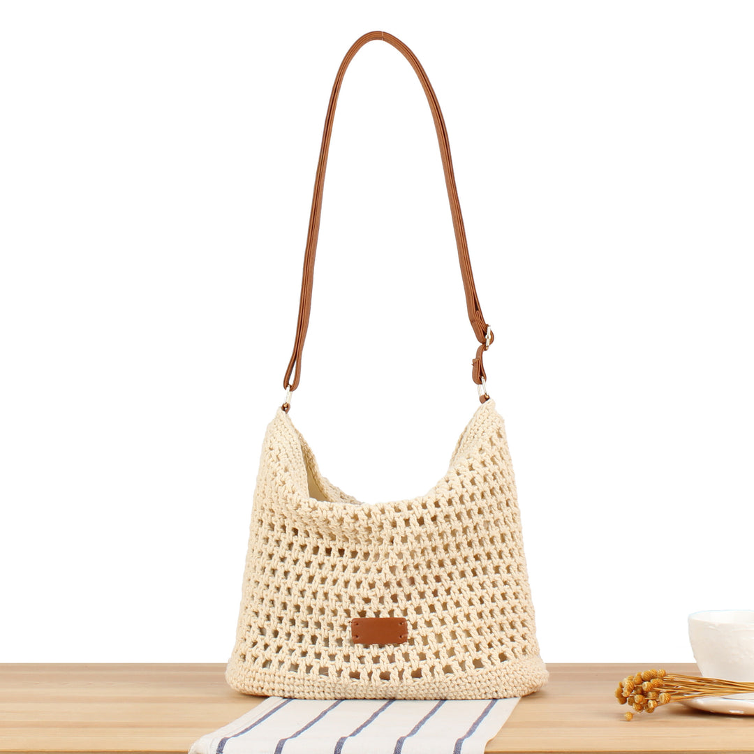 Handbag in hand-woven natural material with leather accents Skanto