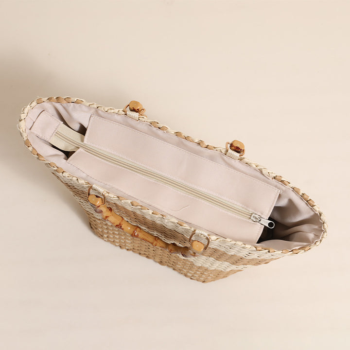 Braided straw bag with bamboo handle and decorative lining Skanto