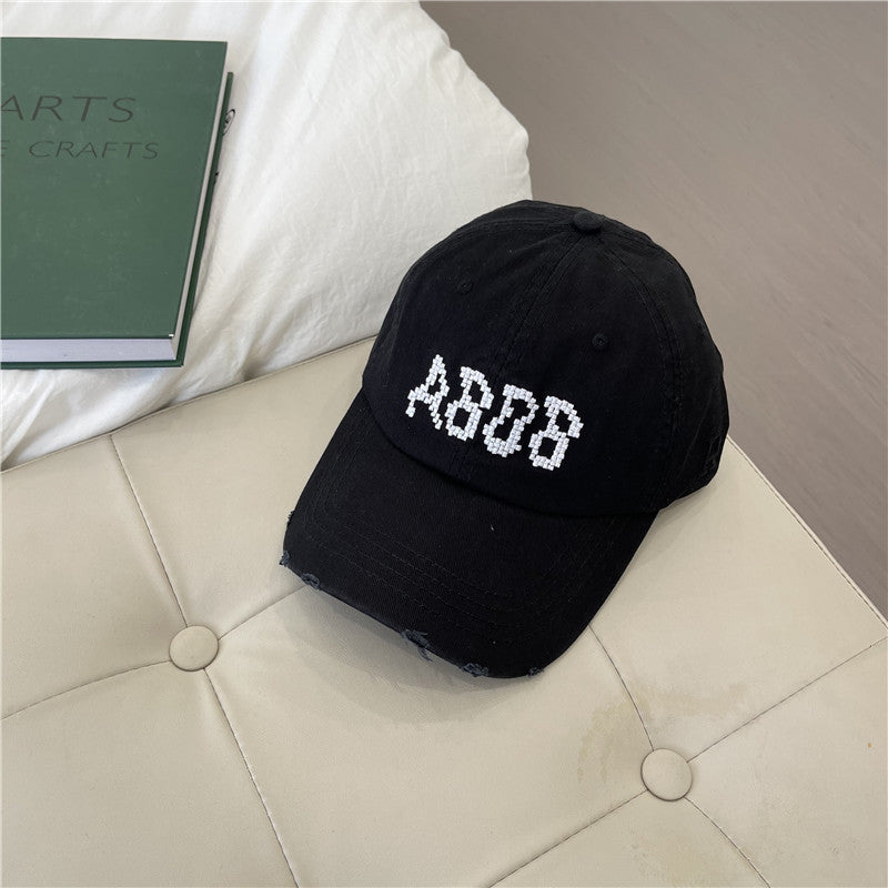 Kvinnens slitte bomull baseballcaps med grafisk detaljer Skanto