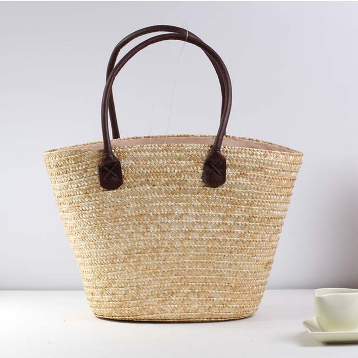 Braided beach bag with colorful embroidery pattern Skanto