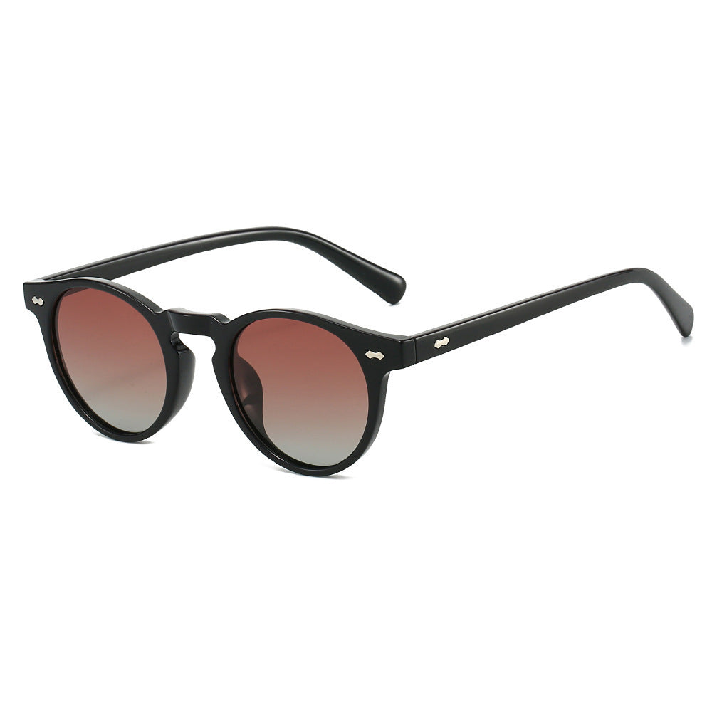 Dame vintage solbriller med runde glass og transparent ramme Skanto