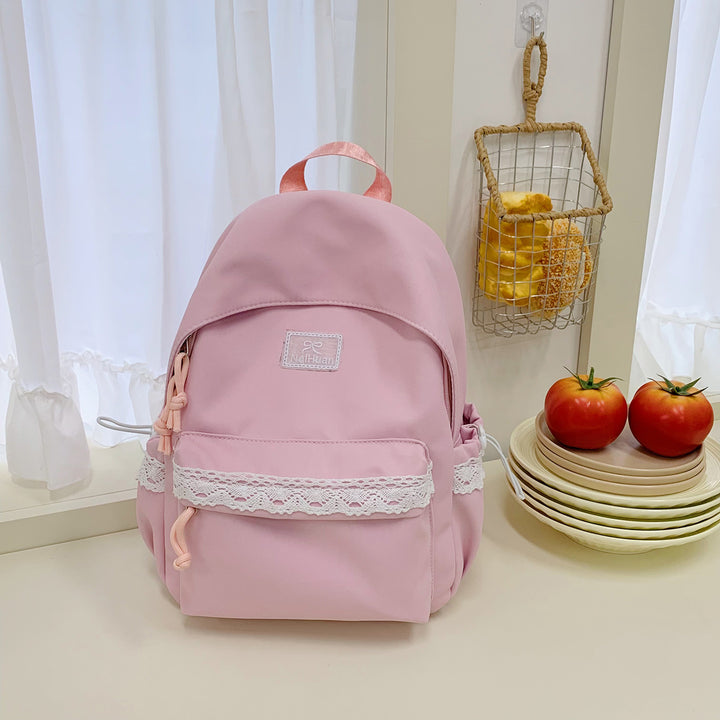 Elegant skolesekk med lacedetaljer