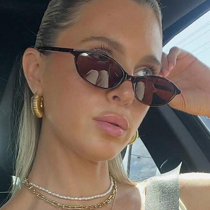 Women's oval sunglasses with transparent frame and UV protection Skanto