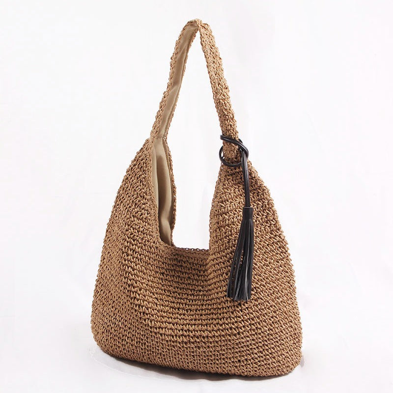 Handmade and stylish shoulder bag with decorative tassel detail Skanto