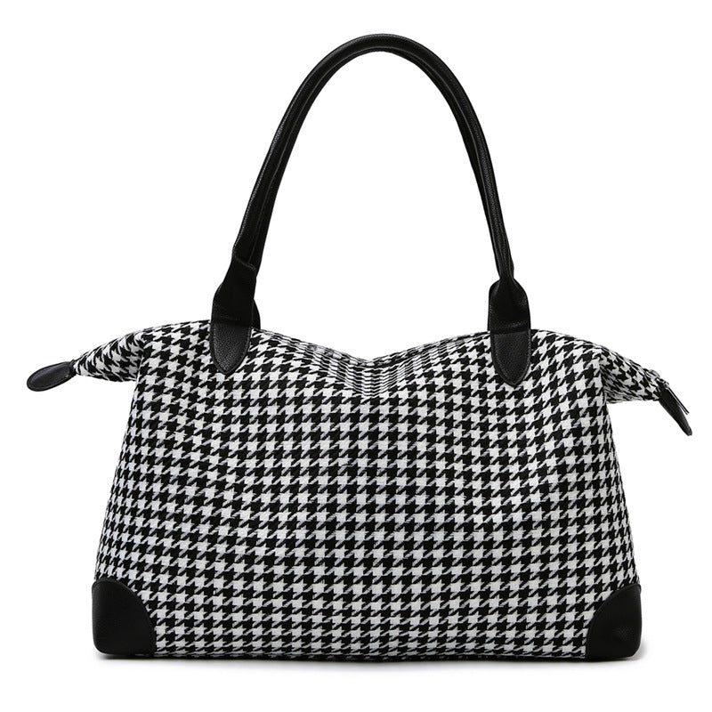 Moderne håndveske i tidløs houndstooth-mønster Skanto