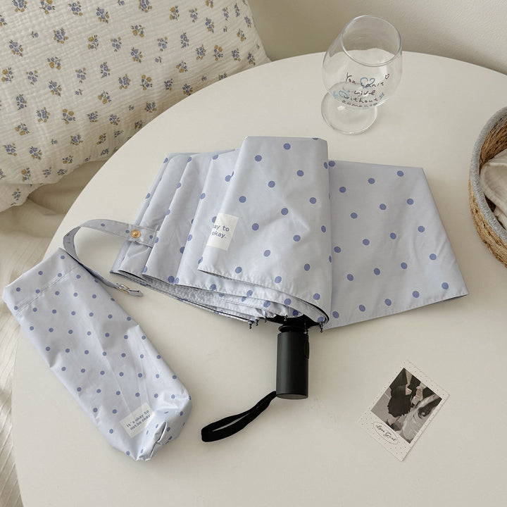 DameFaltparaply med robust mekanisme og stillegant design Skanto