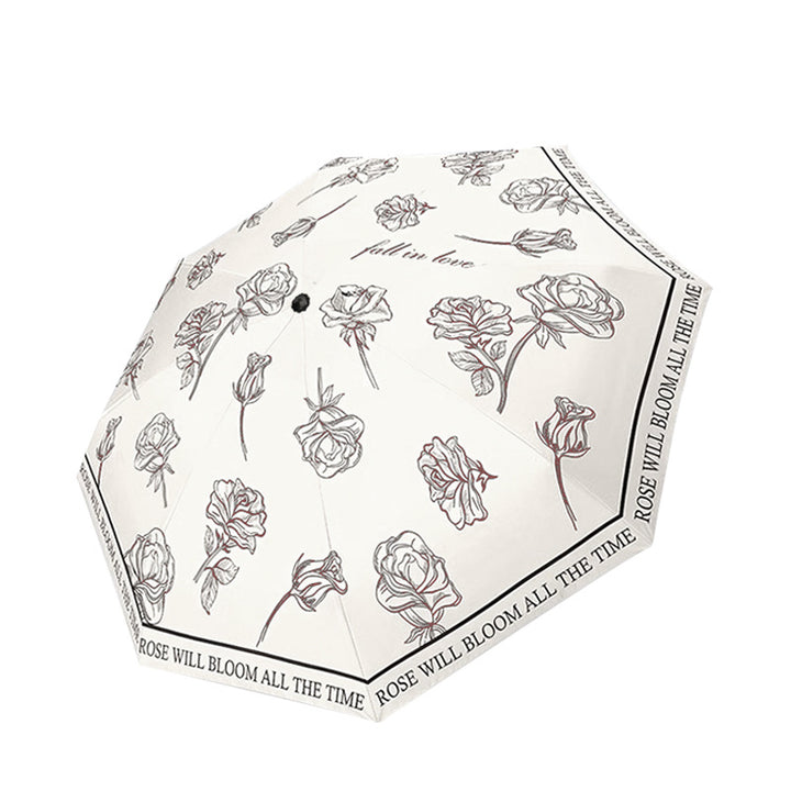 Kvinnenes sammenleggbare paraply med transparent blomsterdesign Skanto