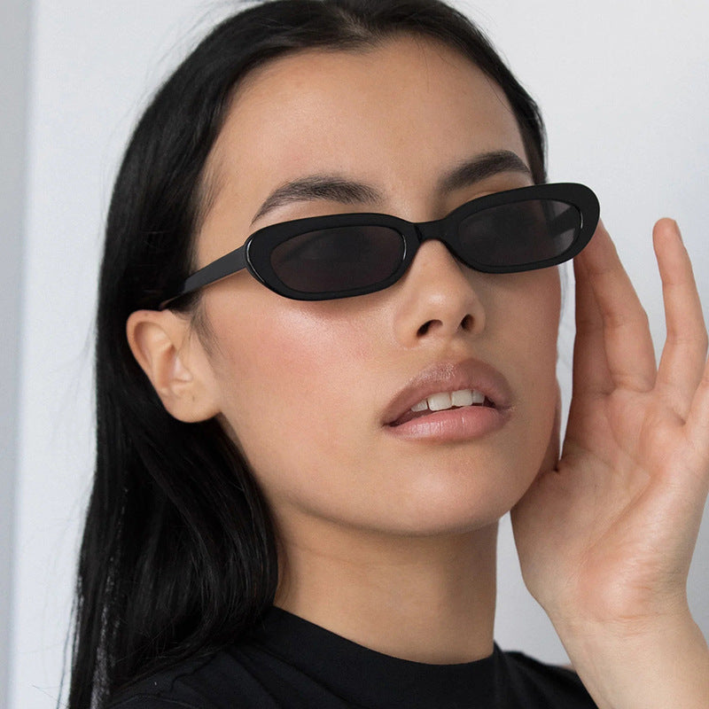 Women's fashionable cat-eye sunglasses with transparent plastic frame and UV protection Skanto