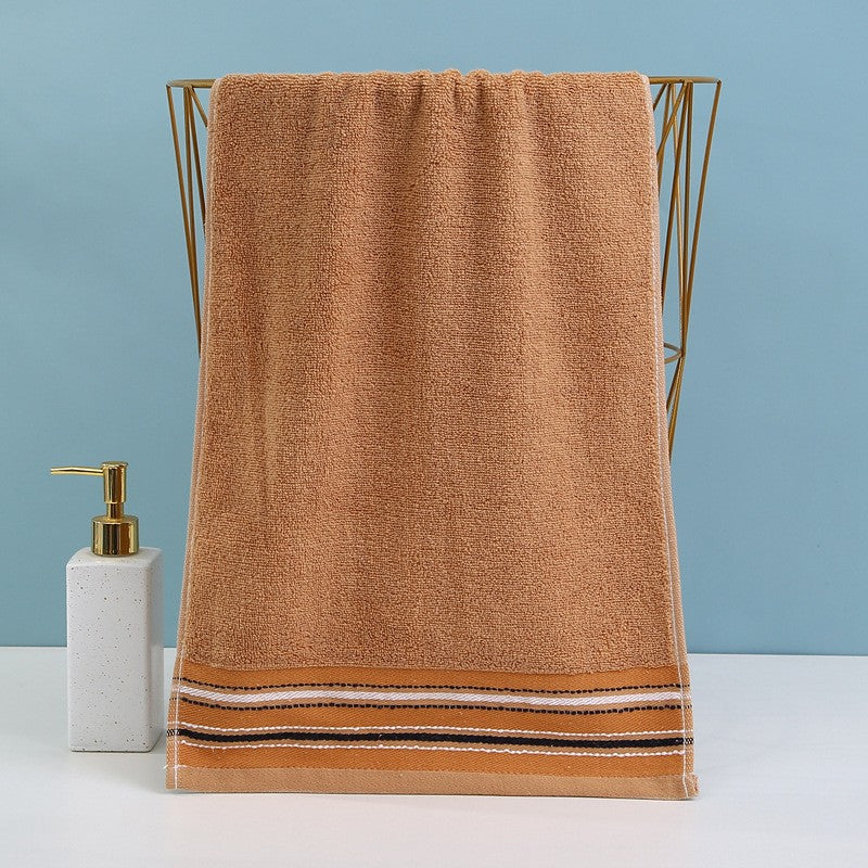 Premium Frottéhåndkle med elegant striperåndbord.