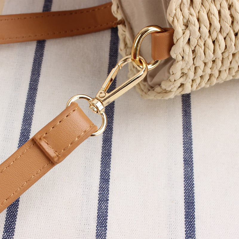 Woven natural material handbag with detachable leather handles Skanto