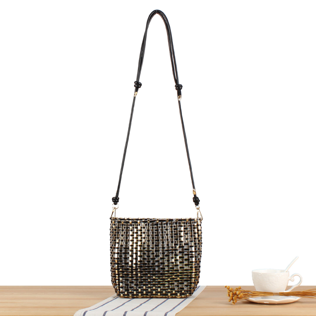 Shoulder bag made of hand-woven synthetic material with fashionable sliding mechanism Skanto