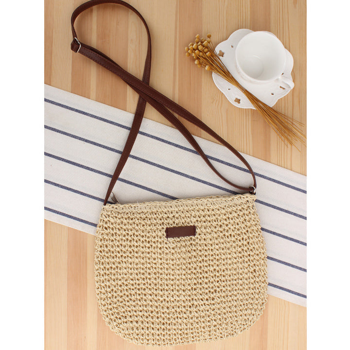Shoulder bag in woven natural material with detachable leather strap Skanto