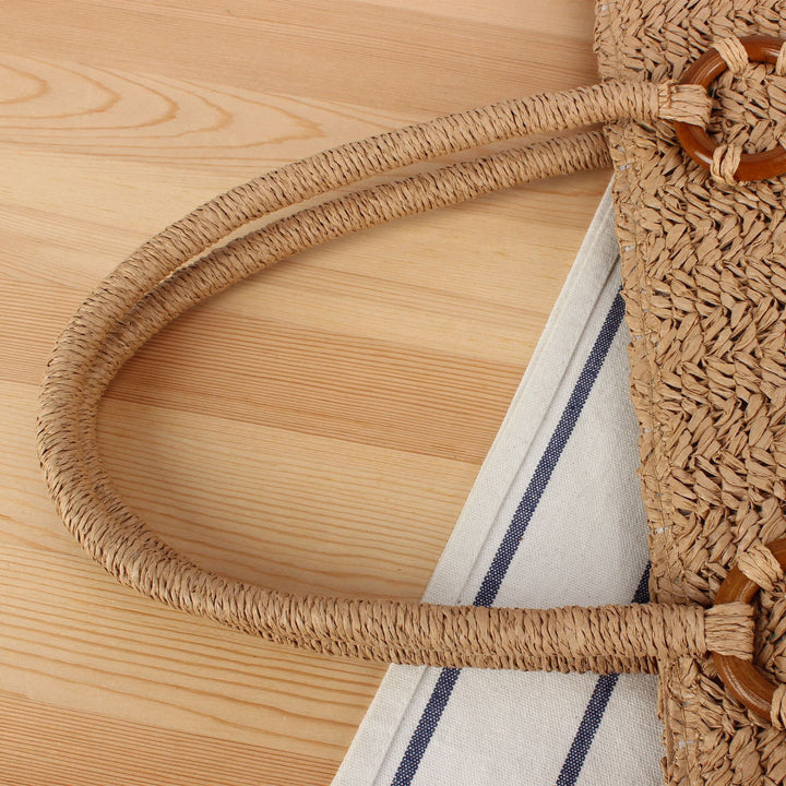 Beach bag in natural woven material with sturdy handles Skanto