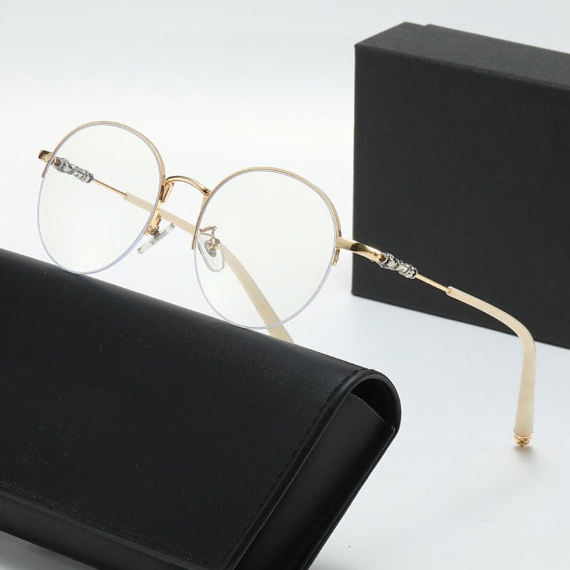 Dame rund solbrille med elegant metallramme og komfortable nesepads Skanto