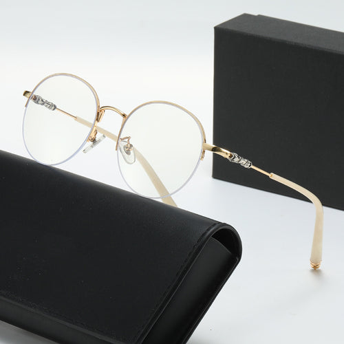 Dame rund solbrille med elegant metallramme og komfortable nesepads Skanto