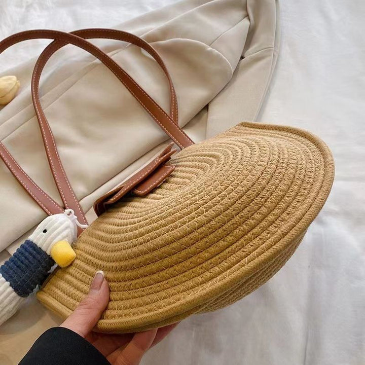 Modern tote bag made of woven material with playful pendant Skanto