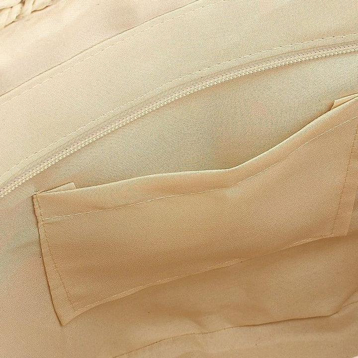 Handveske med fargerike flettede detaljer Skanto