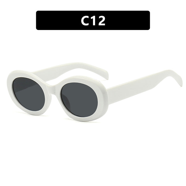 Women's fashionable sunglasses in original oval design with transparent frame and UV protection Skanto
