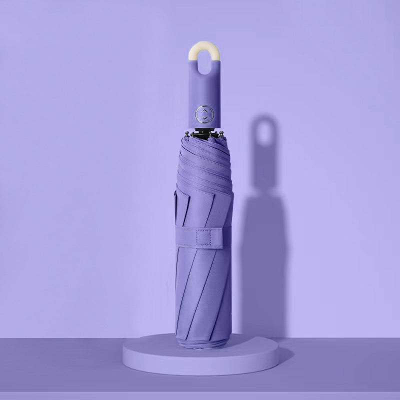 Dame elegant foldes regnparaply med ergonomisk håndtak og UV-beskyttelse Skanto