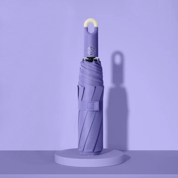 Dame elegant foldes regnparaply med ergonomisk håndtak og UV-beskyttelse Skanto
