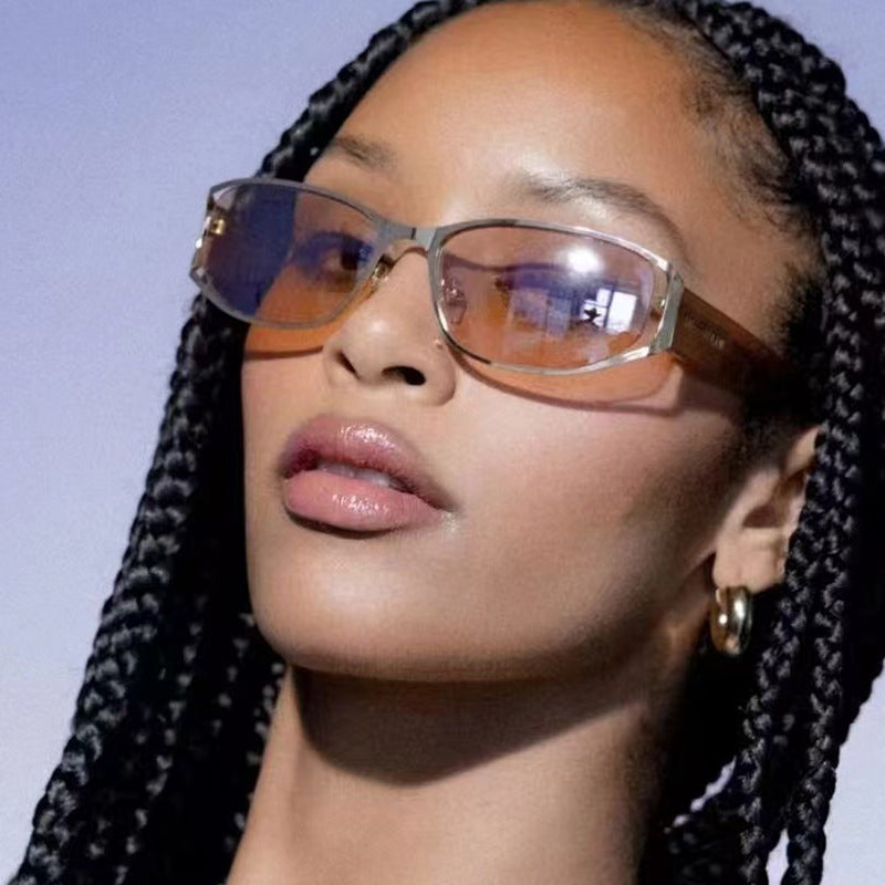 Women's modern sunglasses with elegant contours and protective UV filter Skanto