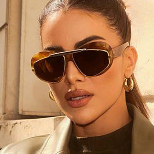 Dame futuristisk solbrille med elegant ramme Skanto