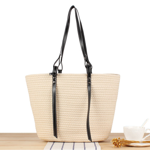 Elegant Beach Bag in Woven Natural Material with Stylish Leather Accents Skanto
