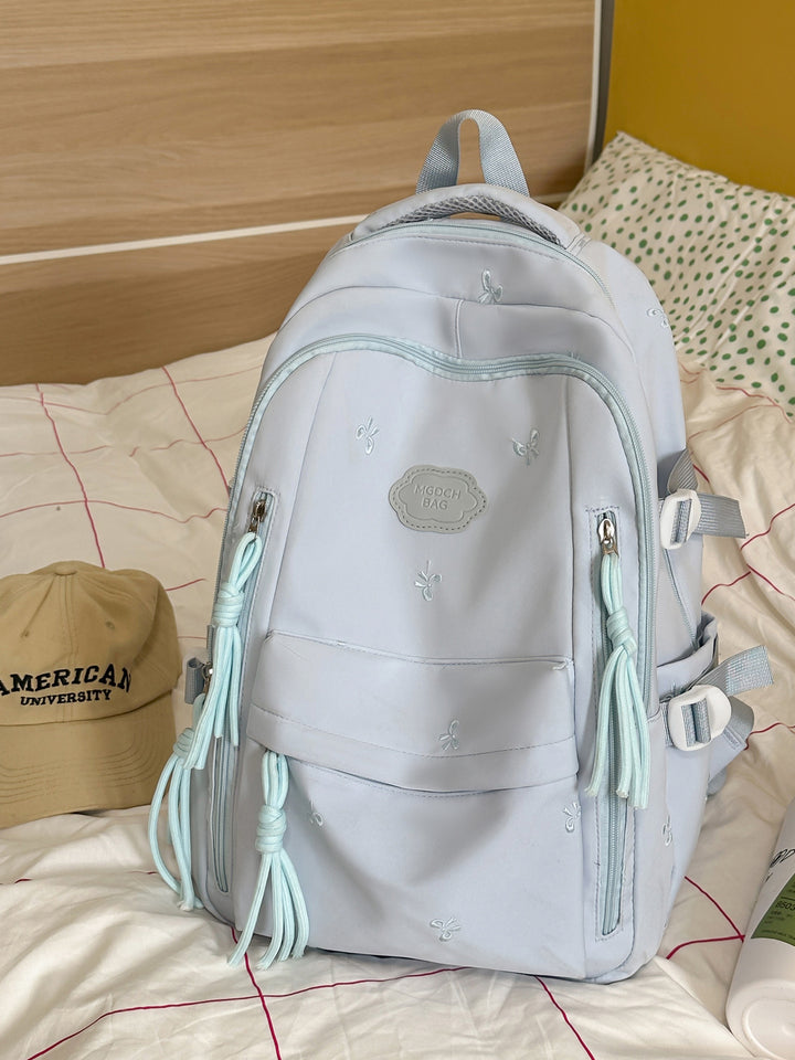 Detaljert brodert skole ryggsekk