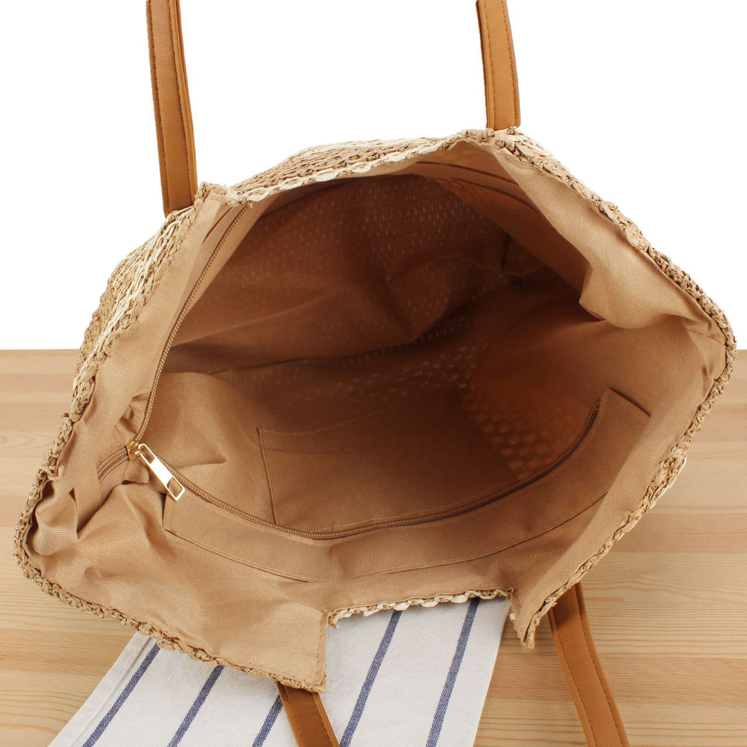 Tote bag made of woven natural material with elegant leather handles Skanto