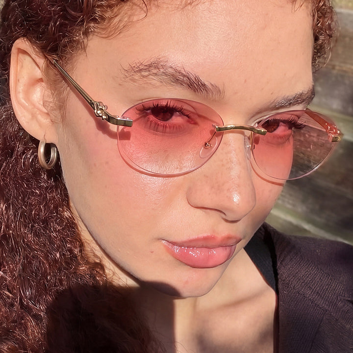 Women's elegant oval sunglasses with gold accent Skanto