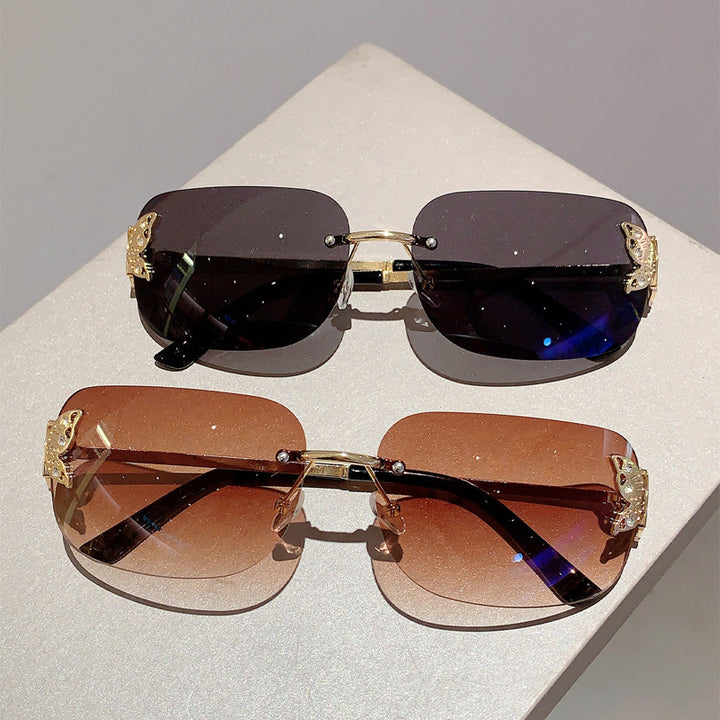 Women's fashionable sunglasses with filigree butterfly design and protective lenses Skanto