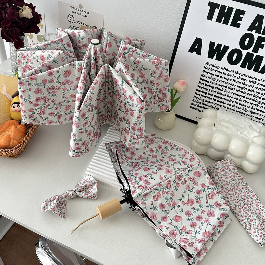 Dame sammenleggbare paraply med blomsterdesign og praktisk oppbevaringssystem Skanto