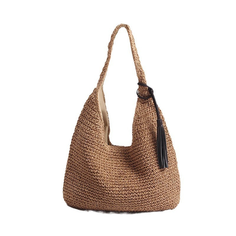 Handmade and stylish shoulder bag with decorative tassel detail Skanto
