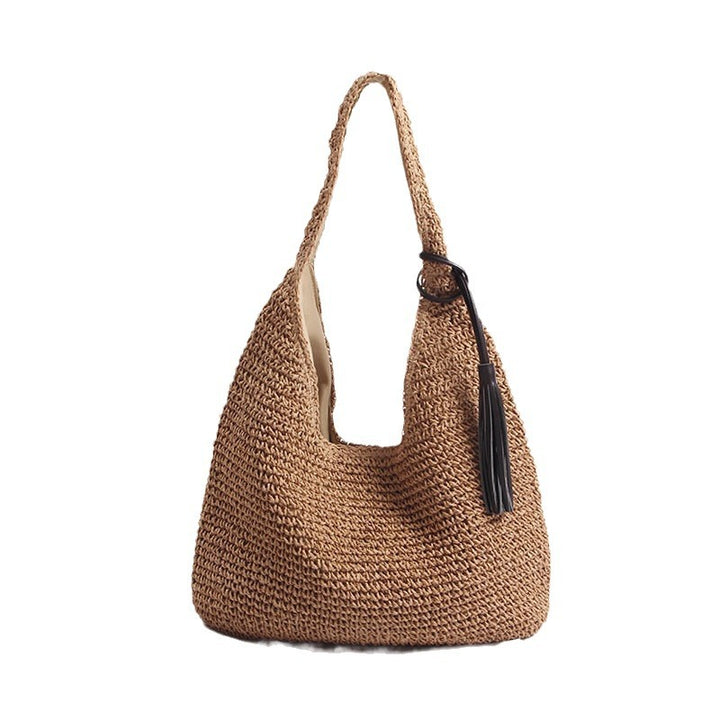 Handmade and stylish shoulder bag with decorative tassel detail Skanto