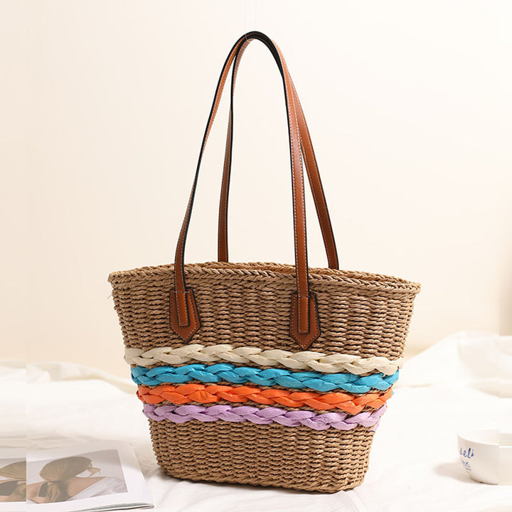 Basket-style straw bag with colorful braided accents Skanto