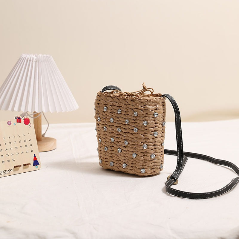 Woven natural material handbag with sparkling applications Skanto