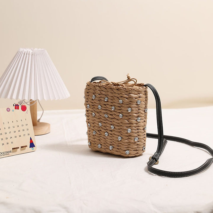 Woven natural material handbag with sparkling applications Skanto