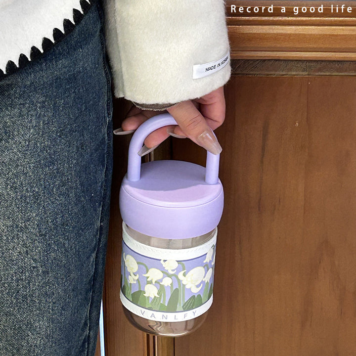 Dame isolerende drikkeflaske med ergonomisk håndtak og elegant blomsterdesign Skanto