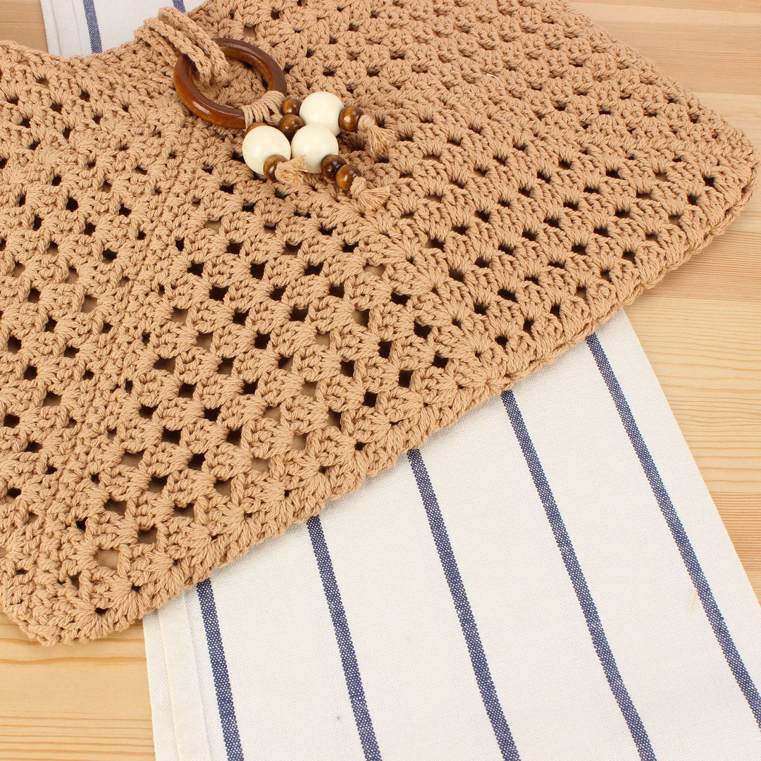 Handbag made of hand-knotted natural material with stylish fringe details Skanto