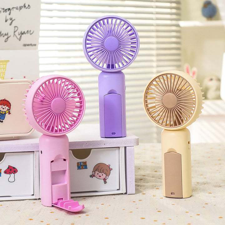 Kvinne bærbar mini håndvifte med USB-ladingsfunksjon og ergonomisk design Skanto
