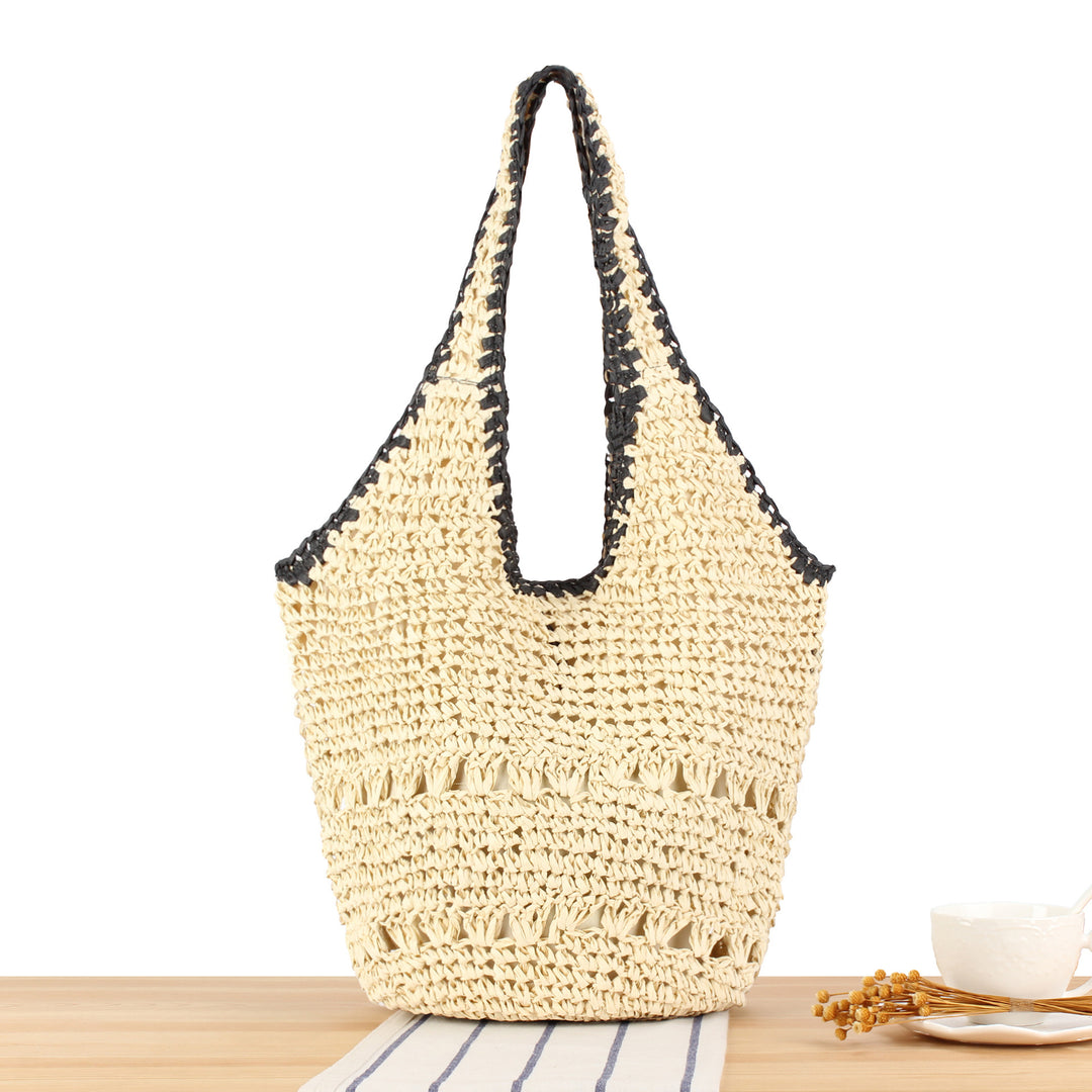 Beach shoulder bag made of hand-woven natural material with comfortable carrying handles Skanto