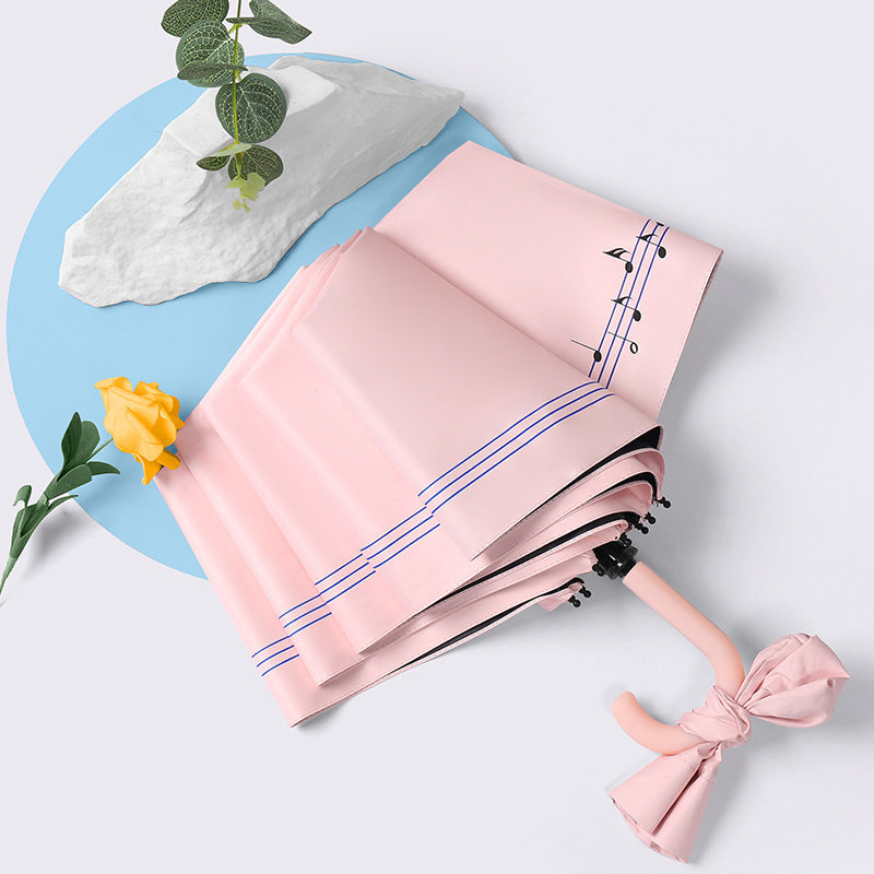 Dame elegant sammenleggbar paraply med hjerteformet design Skanto