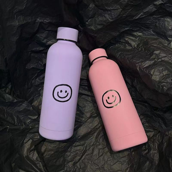 Damen Isoliertrinkflaske med lyst smilmotiv Skanto